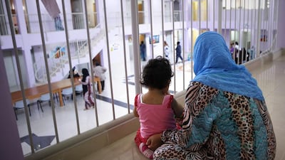 A mother and her child sit together.