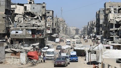 Displaced Palestinians make their way as they flee from one area to another within Gaza city, amid an Israeli military offensive. Reuters