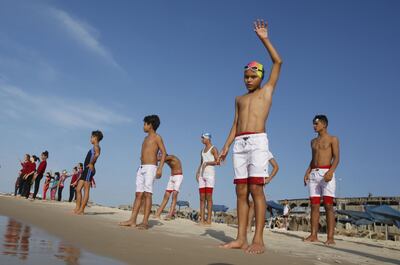 Young Palestinian members of a swimming club prepare to swim during training session in the northern Gaza Strip, on October 4, 2018. AFP
