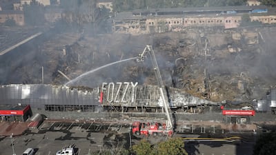 First responders work at the site of a shopping centre destroyed by a Russian attack in Odesa. Reuters