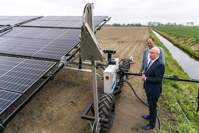 Dutch Minister of Agriculture, Nature and Food Quality Henk Staghouwer looks at a mobile solar park in Oude Tonge, The Netherlands. EPA