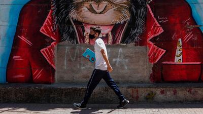 A boy walks wearing a face mask as a preventive measure against the spread of the coronavirus in Esteli, Nicaragua. AFP