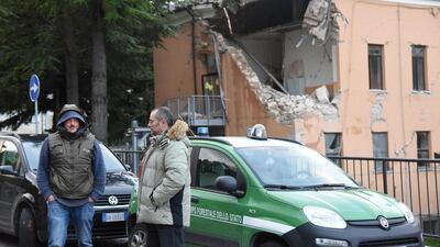 Rescue teams outside a damaged building in Visso, Marche region, central Italy on October 27, 2016, a day after two strong earthquakes hitting the region. Matteo Crocchioni/EPA