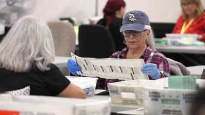 Election workers open mail-in ballots at the Maricopa County Tabulation and Election Centre in Phoenix, Arizona. AFP