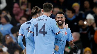 Riyad Mahrez celebrates scoring with Jack Grealish and Aymeric Laporte. Reuters