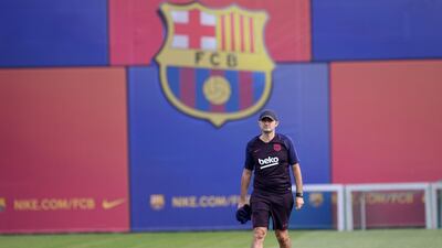 Barcelona coach Ernesto Valverde lays out cones. AFP