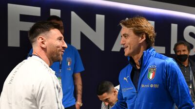 Italy head coach Roberto Mancini and Lionel Messi of Argentina shake hands. Getty Images