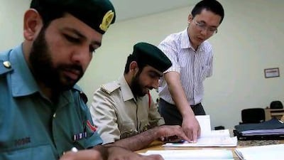 Dubai Police attends the Chinese class at the Dubai Police Academy in Dubai. Satish Kumar / The National