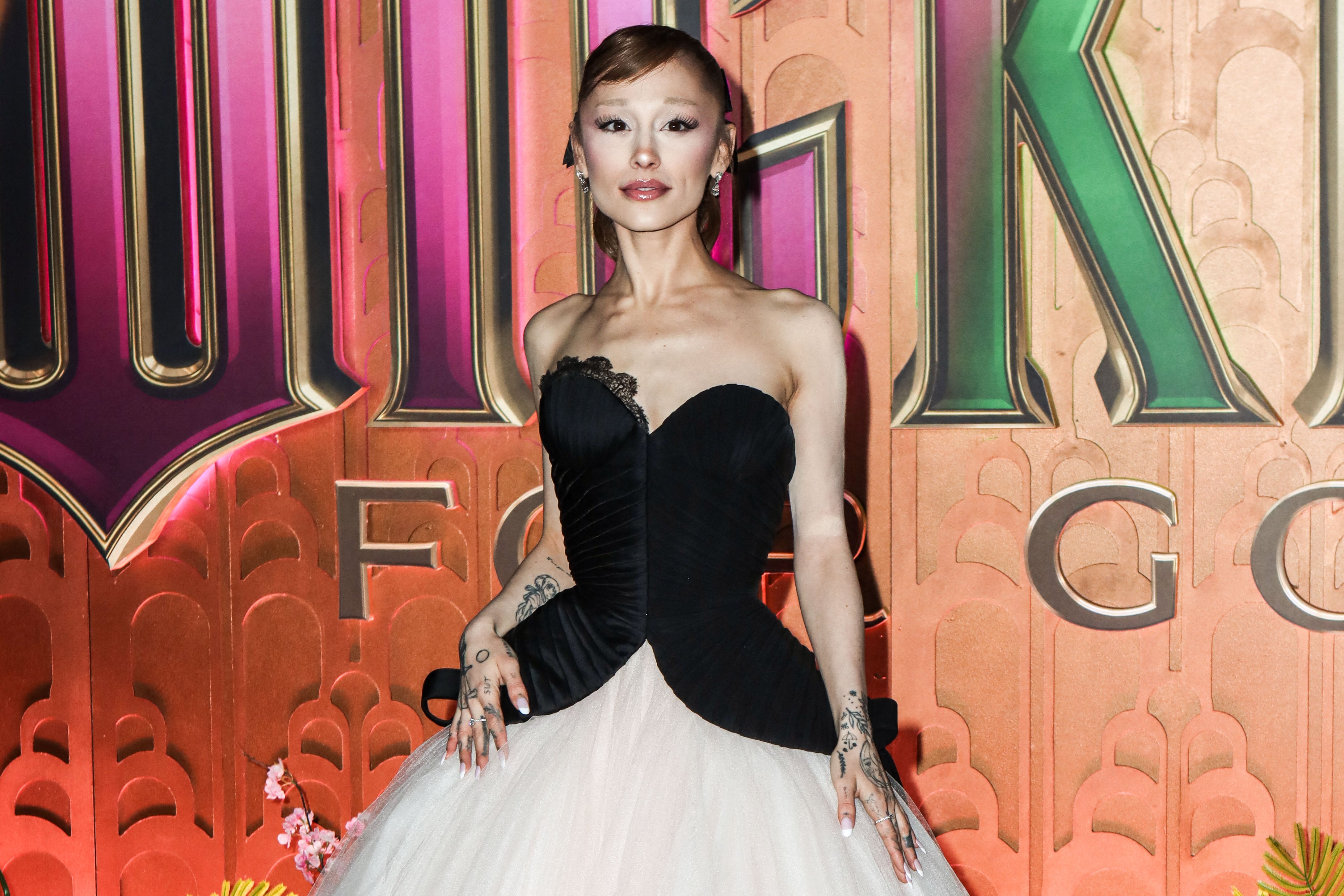 Image linked from the original feed: Why is Ariana Grande stepping out of spotlight now, after railing against comments about her body for years?