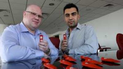 David McKern and Ahmad Zahran of Infinitec with a number of IUMs at their office in the Liwa Heights tower in Dubai.