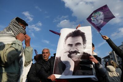 A demonstrator holds a picture of jailed Kurdish militant leader Abdullah Ocalan during a rally in Diyarbakir, Turkey. Reuters