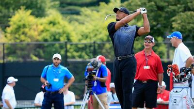 Tiger Woods hits balls on the driving range at Congressional Country Club on Tuesday in Bethesda, Maryland, USA. Rob Carr / Getty Images / AFP / June 24, 2014