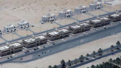 Aerial photograph of green and desert in Liwa, the Western Region of Abu Dhabi.