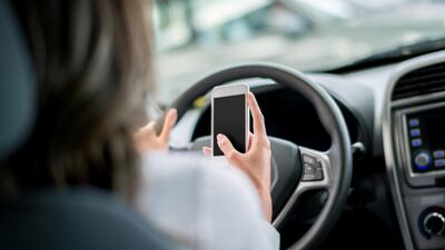 Smartphone users have, for many years, had the option of downloading apps that stop notifications at the wheel. Getty Images