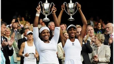 Serena Williams, left, and sister Venus, won the Wimbledon women's doubles title for the fourth time.