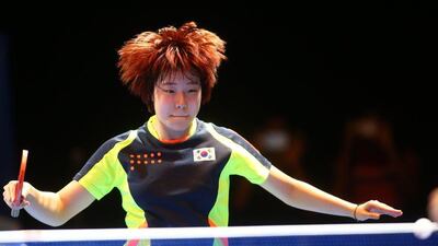 Lee Zion of South Korea returns the ball to Tie Yana of Hong Kong during their women’s singles table tennis qualifying match in the ITTF Table Tennis Asian Cup, on April 28, 2016 in Dubai. AFP / MARWAN NAAMANI