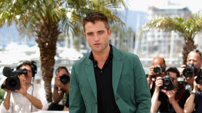 A modern look in a green sports jacket and black polo shirt and jeans, at 'The Rover' photocall during the 67th Annual Cannes Film Festival on May 18, 2014. Getty Images