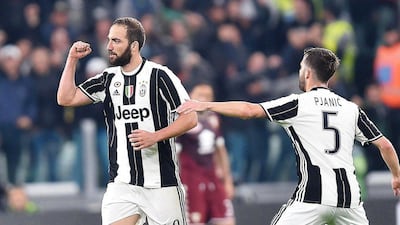 Juventus' Gonzalo Higuain, left, celebrates with his teammate Miralem Pjanic after scoring the 1-1 equaliser during the Italian Serie A match against Torino at Juventus Stadium in Turin, Italy, 06 May 2017. Alessandro Di Marco / EPA