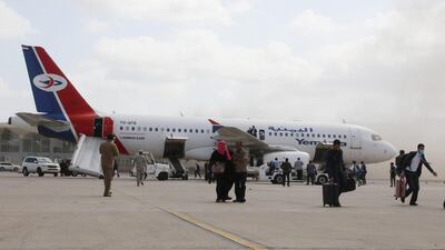 People walk away from a plane that carried a newly formed cabinet for government-held parts of Yemen, after an attack at Aden airport shortly after the plane's arrival, in Aden, Yemen. REUTERS