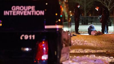 Police detain a protester as they enforce a night curfew imposed by the Quebec government to help slow the spread of the coronavirus disease (COVID-19) pandemic in Montreal, Quebec, Canada January 9, 2021. REUTERS/Christinne Muschi