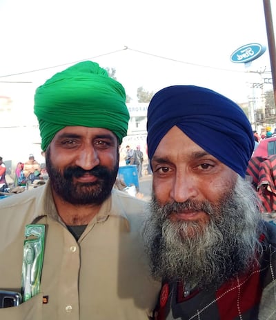 Narpinder Singh, left, with fellow farmer Balwinder Singh at the protests outside New Delhi, India.