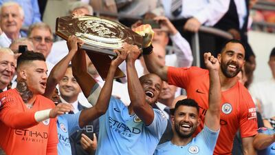 LONDON, ENGLAND - AUGUST 05: The Manchester City players celebrate as Vincent Kompany and Fernandinho lift the Community Shield trophy during the FA Community Shield between Manchester City and Chelsea at Wembley Stadium on August 5, 2018 in London, England. (Photo by Clive Mason/Getty Images)