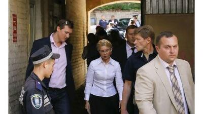 Yulia Tymoshenko, centre, formerly the Ukrainian prime minister, has been arrested for failing to acknowledge the legitimacy of her trial. A reader says the arrest shows she cannot get a fair trial. Reuters / Sergei Svetlitsky