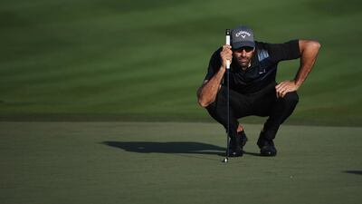 Alvaro Quiros of Spain lines up a putt on the second green. Ross Kinnaird / Getty Images