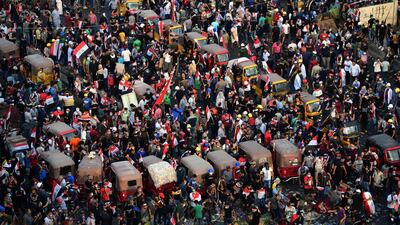 Iraqi protesters gather during a protest at al-Tahrir square, central Baghdad, Iraq. EPA