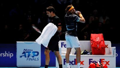 Roger Federer, left, and Stefanos Tsitsipas. Reuters