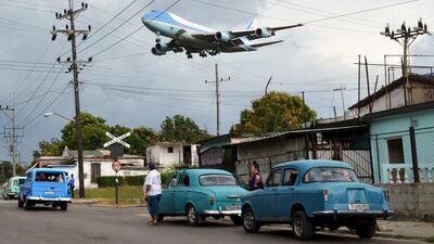 Air Force One carrying US president Barack Obama and his family flies over a neighborhood of Havana as it approaches the runway to land at Havana's international airport on March 20, 2016. Reuters