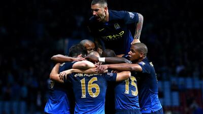 Sergio Aguero celebrates with teammates after his goal made it 2-0 in Manchester City’s favour. Ian Walton / Getty Images