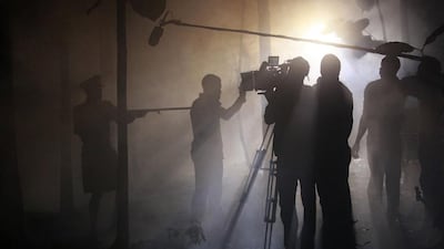 Actors perform a scene at night while filming ‘October 1’, a police thriller directed by Kunle Afolayan, in Akure, Nigeria.