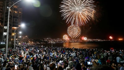 People gather to watch fireworks during New Year celebrations in the coastal city of Vina del Mar, Chile. Reuters