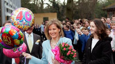 The duchess, in a baby blue two-piece, visits Collingwood College on her 40th birthday in January 2005 in Surrey, England. Getty Images