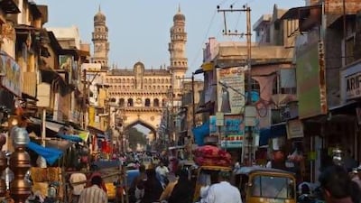 The busy thoroughfare of Laad Bazaar with the minarets of Charminar, the city's most famous monument, visible behind. Lonely Planet Images / Getty Images