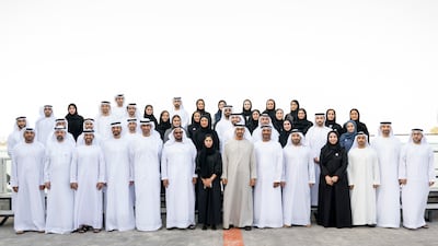President Sheikh Mohamed with Dr Sultan Al Jaber, Minister of Industry and Advanced Technology, managing director and group chief executive of Adnoc, and chairman of Masdar, with members of the Adnoc group, during a Sea Palace barza. Hamad Al Kaabi / Ministry of Presidential Affairs