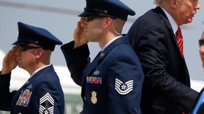 US president Donald Trump is saluted as he boards Air Force One before departing for Arizona from Joint Base Andrews, Maryland, on August 22, 2017. Joshua Roberts / Reuters
