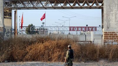 A Turkey-backed Syrian rebel fighter is seen in the town of Tal Abyad, Syria. Reuters