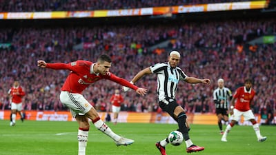 Manchester United's Diogo Dalot in action with Newcastle United's Joelinton. Reuters