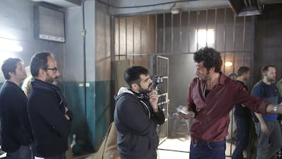 Zinzana’director Majid Al Ansari, centre, with star Ali Suleiman, right, and producer Rami Yasin on set. Courtesy Image Nation