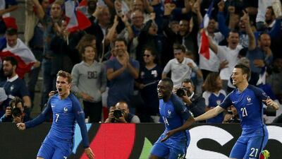 Antoine Griezmann, left, celebrates after giving France the lead against Albania. Guillaume Horcajuelo / EPA