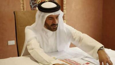 The newly appointed member of the World Motorsport Council, Mohammed Ben Sulayem looks over a map of the new Formula One Race Track that is being built in Abu Dhabi in this file photo from Oct 16 2008.
