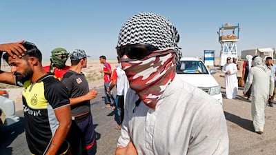 Protesters demonstrate against unemployment in front of oil fields in al-Qurnah, some 100 kilometers north of Basra, southern Iraq. AFP