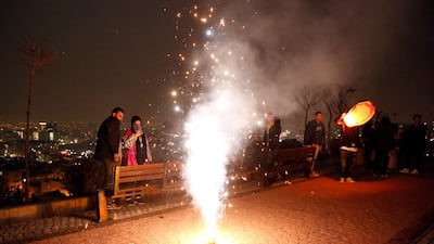 People gather to mark the traditional Charshanbeh Suri fire festival, in Tehran. It is held on the eve of the last Wednesday before Nowruz, the Iranian New Year, which starts on March 21. EPA
