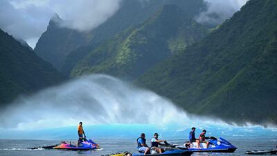 People take jet skis on to the water in Teahupo'o, on the French Polynesian island of Tahiti, which will host the surfing events of the Paris 2024 Olympics. AFP