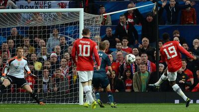 Manchester United striker Danny Welbeck, right, shoots but the goal is disallowed as he is judged to have given away a foul for kicking high early during Tuesday night's Champions League draw against Bayern Munich. Andrew Yates / AFP / April 1, 2014