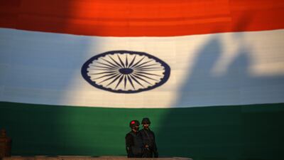 Indian Navy marine commandos stands in front of the Indian national flag, measuring 225 feet in length and 150 feet in width, making it as the world's largest national flag, which has been exhibited during Navy Day celebrations in Mumbai, India, 04 December 2021. The Indian Navy celebrates Navy Day 04 December to commemorate the Indian Navy attack on Karachi harbour during the Indo-Pakistan war in 1971. EPA / DIVYAKANT SOLANKI
