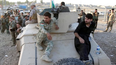 Iraqi Kurdish peshmerga fighters gather north of Kirkuk on October 19, 2017. Ako Rasheed / Reuters