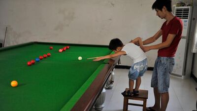 Yin has also discovered his son is ambidextrous and therefore can pocket balls with either hand. Reuters